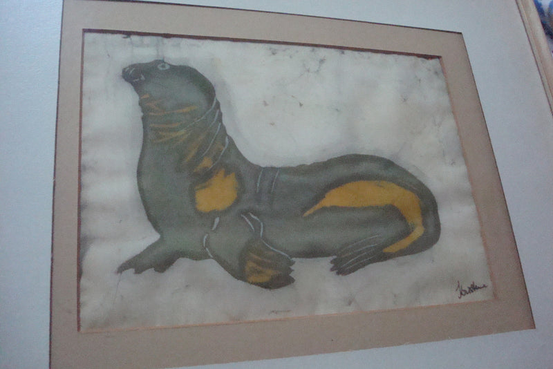 Oil on silk painting of a seal, signed "Kristine", professionally framed