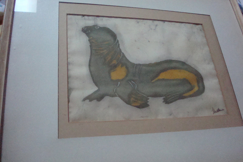 Oil on silk painting of a seal, signed "Kristine", professionally framed