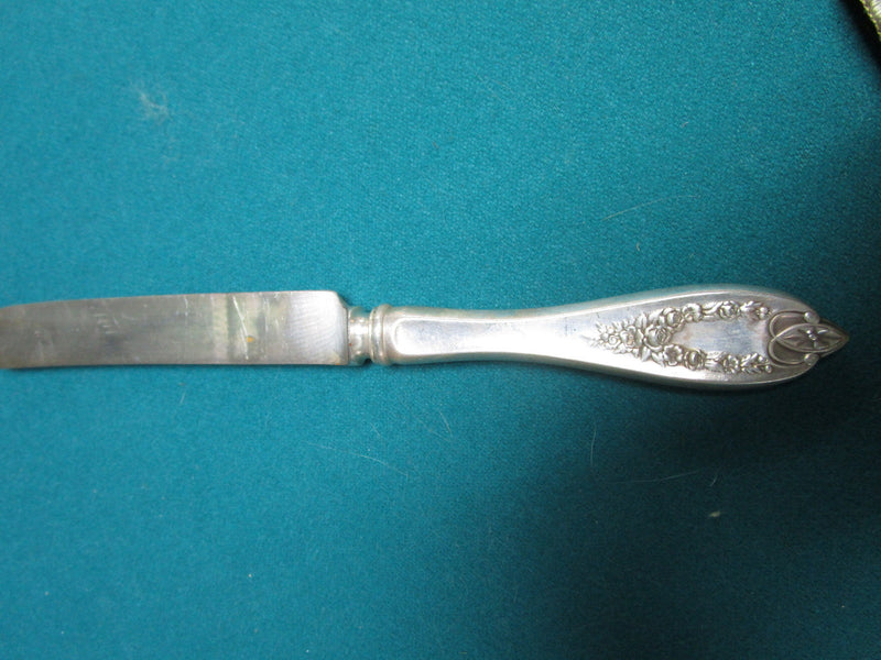 Vintage 11 unmarked  silverplate knives in velvet cover