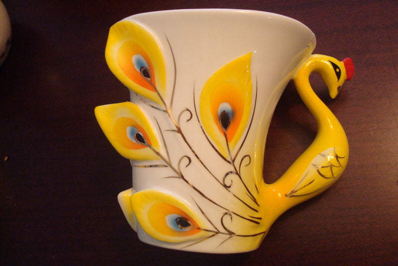 Beautiful cup and saucer from the Peacock Collection, cup ,saucer and spoon orig