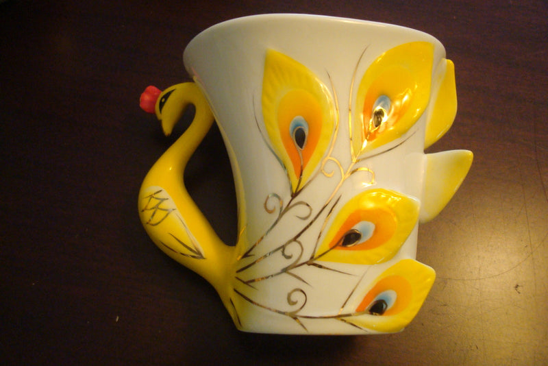 Beautiful cup and saucer from the Peacock Collection, cup ,saucer and spoon orig