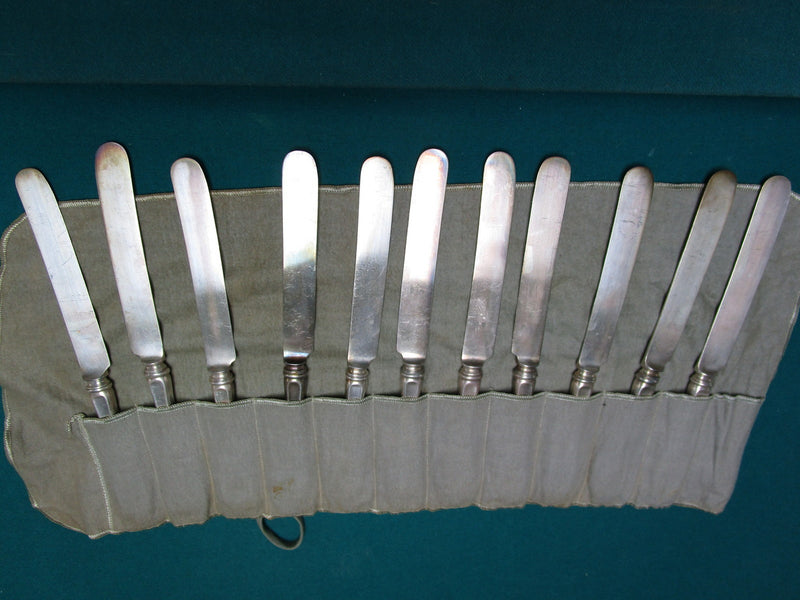Vintage 11 unmarked  silverplate knives in velvet cover