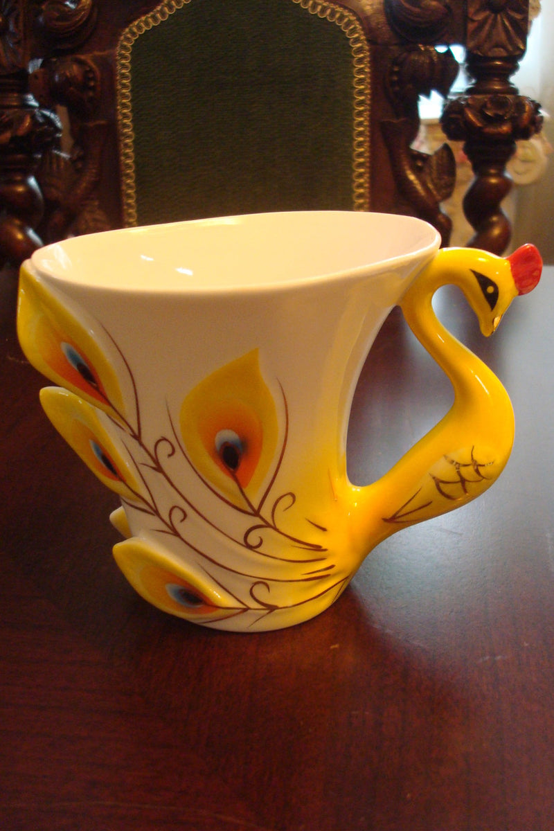 Beautiful cup and saucer from the Peacock Collection, cup ,saucer and spoon orig