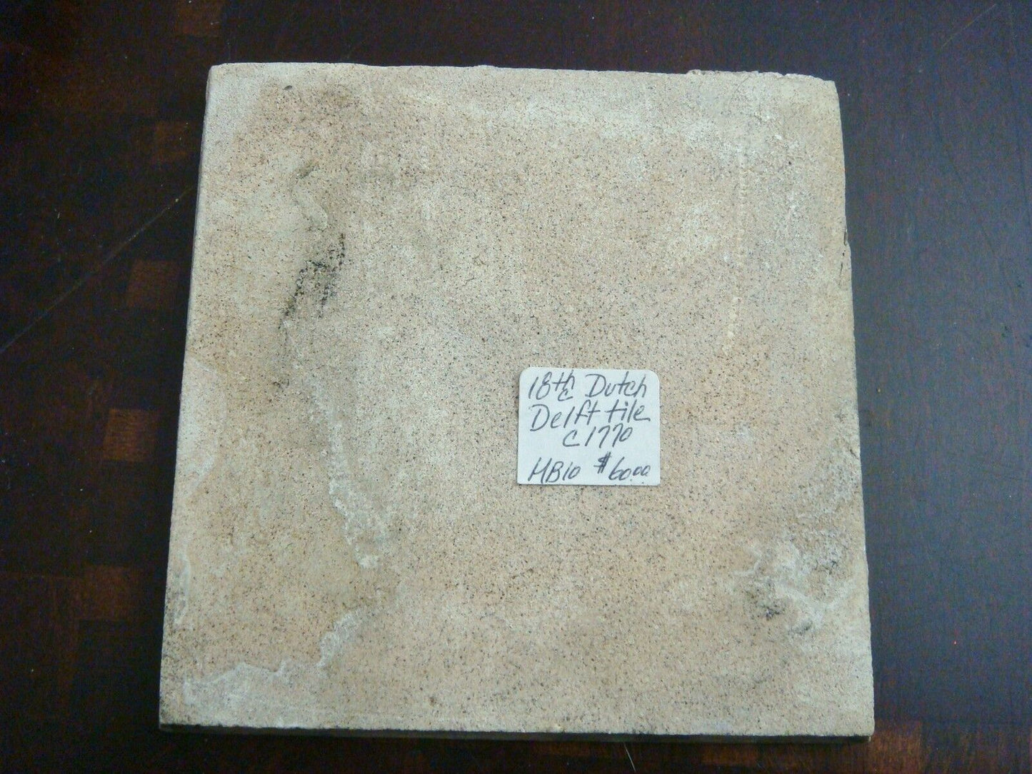 18th century salvaged Delft manganese tile with depictions of country building