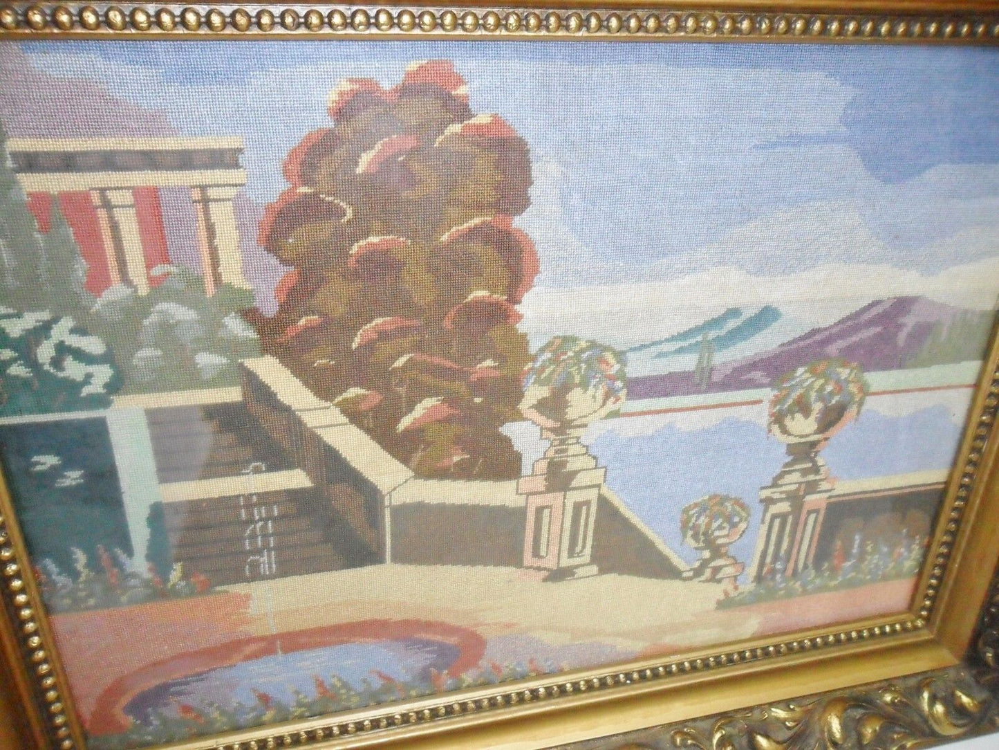 Vintage 1930s needlepoint of a villa and fountain, gorgeous frame