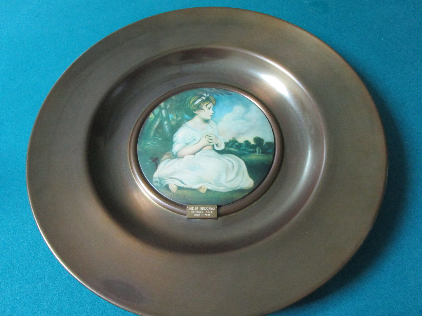 antique BRASS PLATTER PAINTED CERAMIC CENTER "AGE OF INNOCENCE" BY REYNOLDS