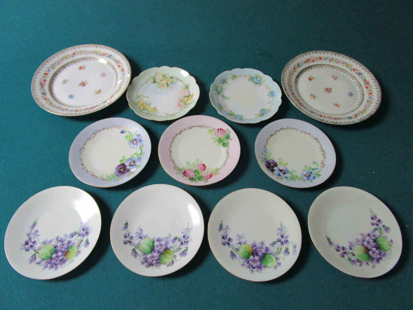 11 GERMAN SIGNED BREAD PLATES AND 2 SALAD PLATES 6" AND 8"