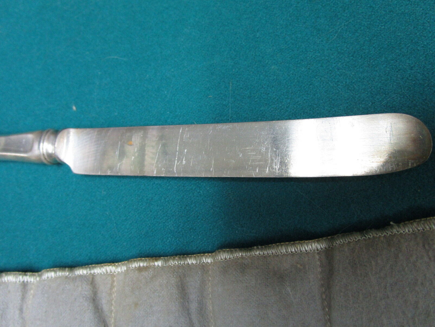 Vintage 11 unmarked  silverplate knives in velvet cover