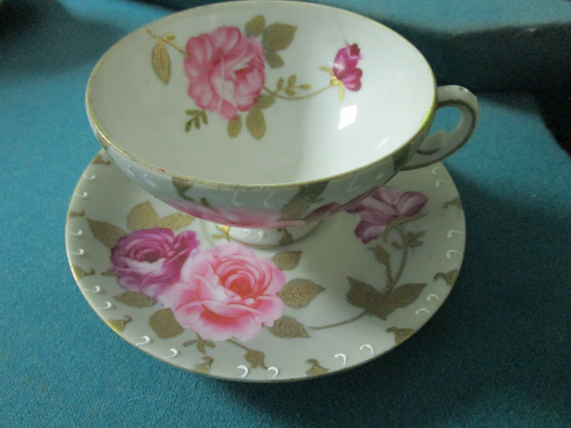 BISQUE FOOTED FLORAL CUP AND SAUCER MADE IN JAPAN HAND PAINTED [170C]