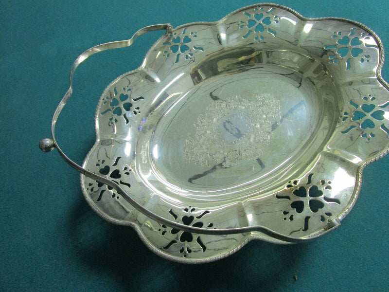 Large silverplate bridal basket with handle, gorgeous decorations footed flowers