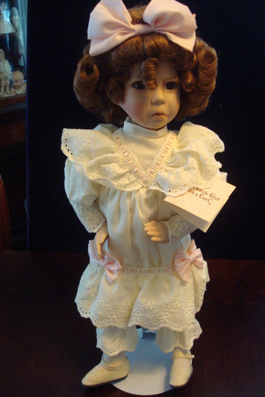 "Little Girl with a Curl" made by Ashton Drake, new original stand included