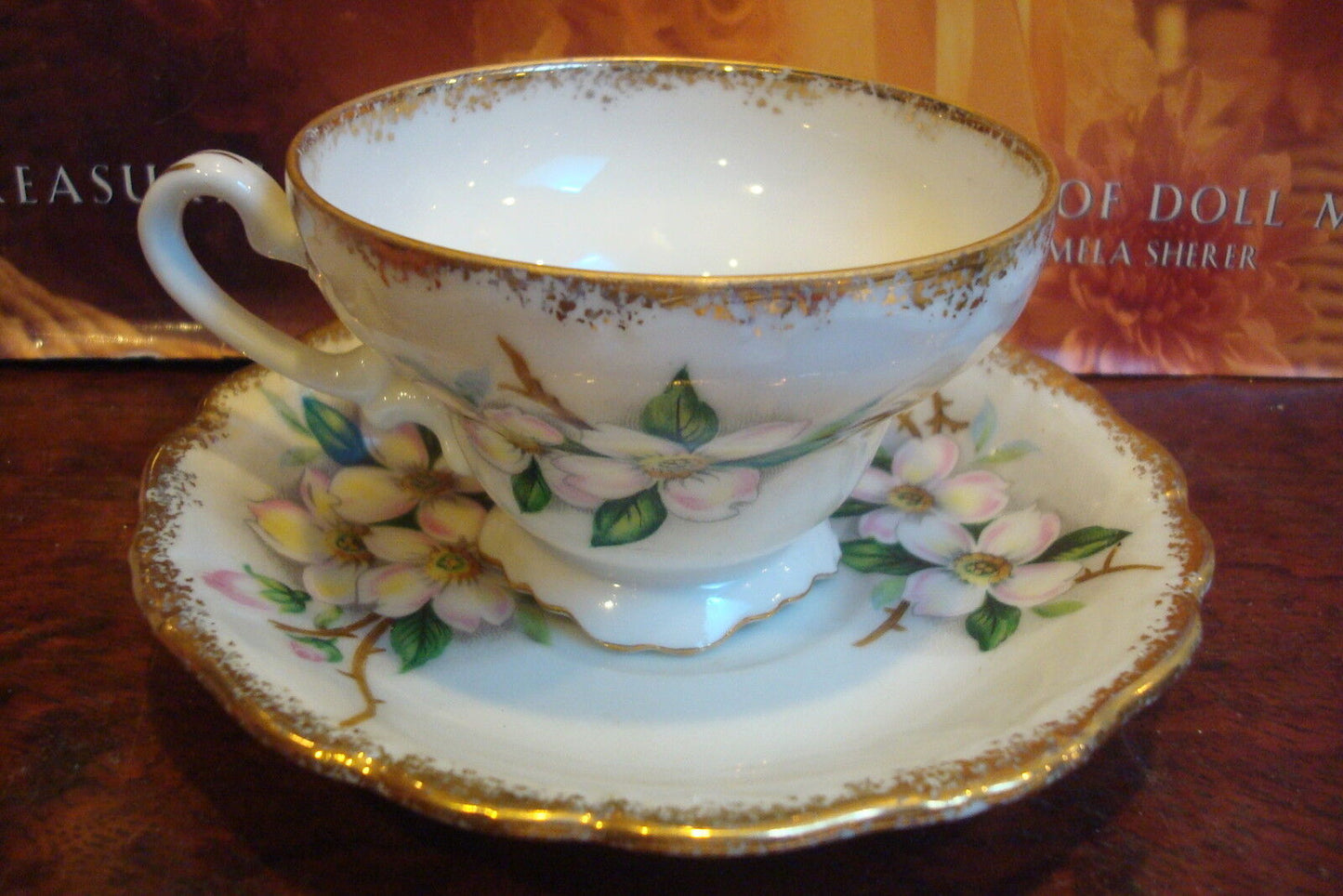 UCAGCO - Dogwood cup and saucer made in Japan, white background pink flowers