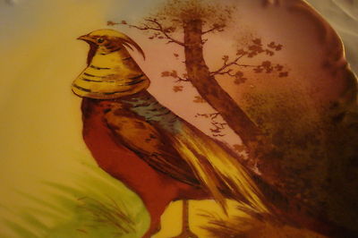 Old German plate decorated with birdsm, molded and ruffled borders, gold guild