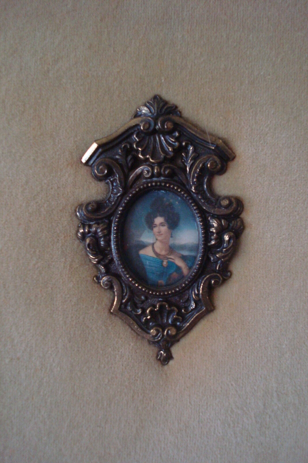 Velvet and cameos, beautiful cameos on a beige velvet in wooden frame. 36 "