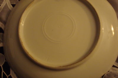 Old German plate decorated with birdsm, molded and ruffled borders, gold guild