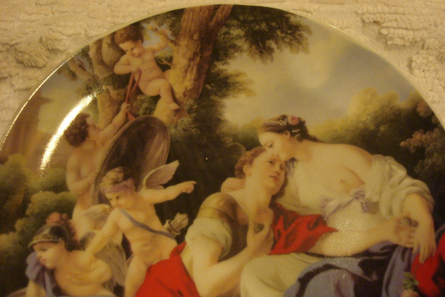 Unmarked collector plate decorated with classical Greek figures and theme, 7"