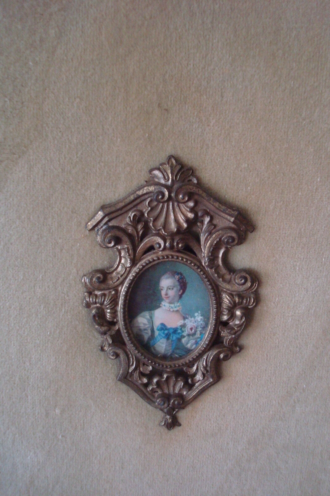 Velvet and cameos, beautiful cameos on a beige velvet in wooden frame. 36 "