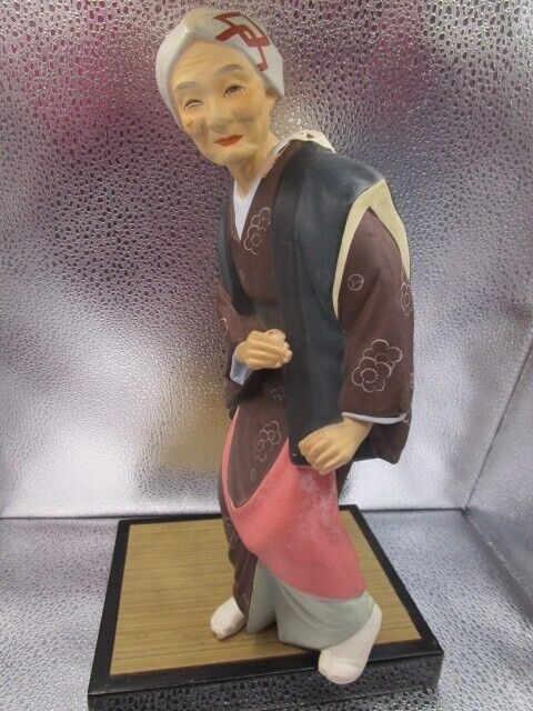 Vintage Hakata Urasaki old lady Clay Figurine 11 1/2" in ratan base