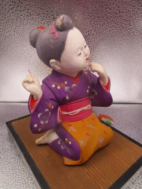 Vintage Hakata Urasaki sewing girl Clay Figurine 9 x 9 x 6" in ratan base