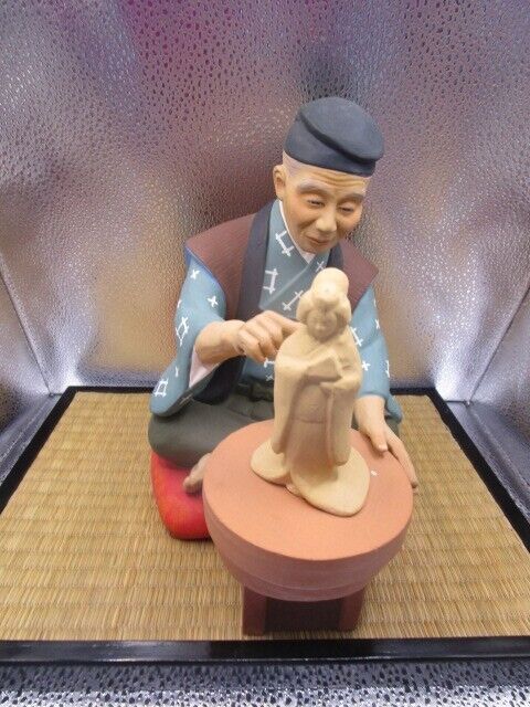 Vintage Hakata Urasaki Doll potter Clay Figurine 9 x 9 x 6" in ratan base