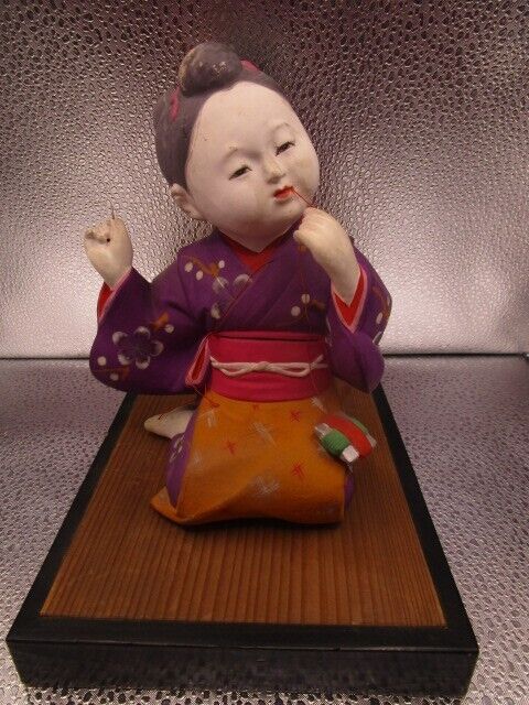 Vintage Hakata Urasaki sewing girl Clay Figurine 9 x 9 x 6" in ratan base